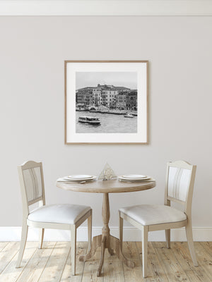 Black and white photograph of boats along a Venice waterfront