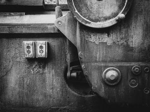 Old start and stop buttons on peeling industrial machinery