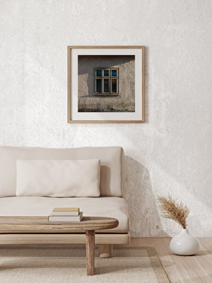 Peeling window frame and rough plaster in a Romanian farmhouse detail