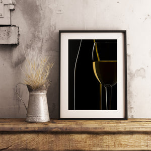 White wine glass with bright gold highlights on a black background
