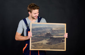 Canyonlands mesas in muted light with a river threading between them