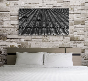 Rows of angled metal panels creating a rhythmic architectural pattern
