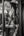 Black and white London photograph layering a pub interior with reflected brick buildings.
