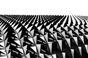 Monochrome upward photograph of triangular façade details beneath a broad white sky in Adelaide.