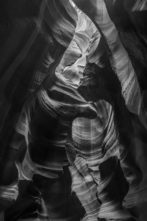 Ribbed rock walls folding inward inside Antelope Canyon.