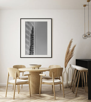Dark architectural reflections bend within the regular window grid of an Argentine building.