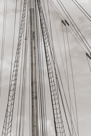 Vertical monochrome nautical photograph of Bluenose II rigging in Lunenburg.