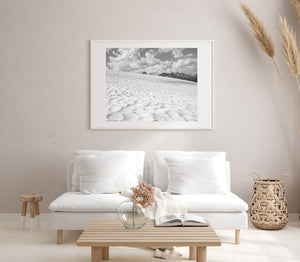 Monochrome Bugaboo landscape with patterned snow and a distant mountain skyline.