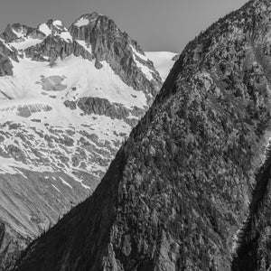 Canadian Rockies mountain face with broad snowfields and exposed rock